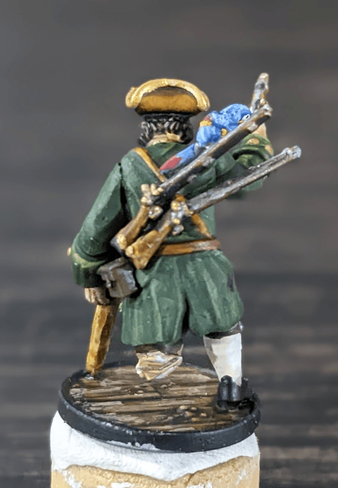 Rear view of the painted Long John Silver 28mm miniature, showing the back details and weapon placement.