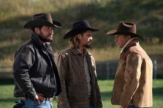 John Dutton news and Yellowstone cast: Kevin Costner, Luke Grimes, and Cole Hauser in a scene from the series.