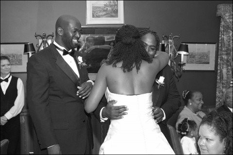Brothers and sister at a wedding, representing familial love and support