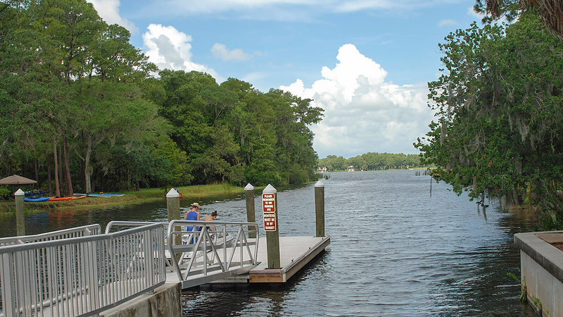 People and kayaks at water access 
