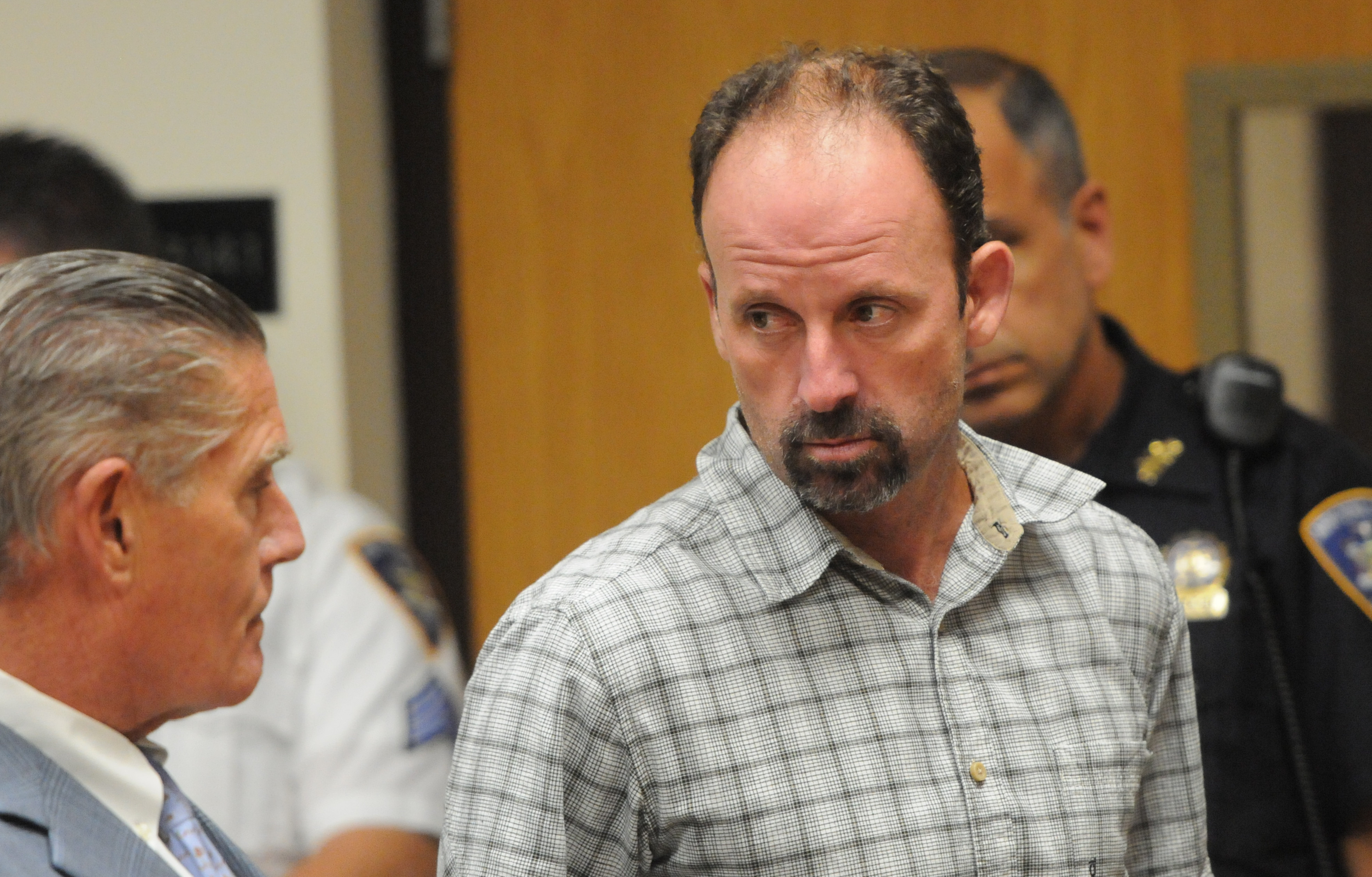 John Bittrolff with his attorney in court, as his case is revisited after new evidence in similar killings.