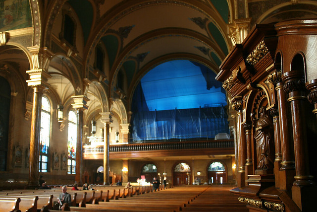 View of the church balcony in St. John Cantius showing preparations for the installation of a new organ, with blue sheeting covering the space.