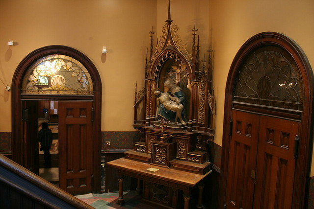 Another view of saint statues inside St. John Cantius Church, showcasing the diverse iconography and artistic representations of religious figures.