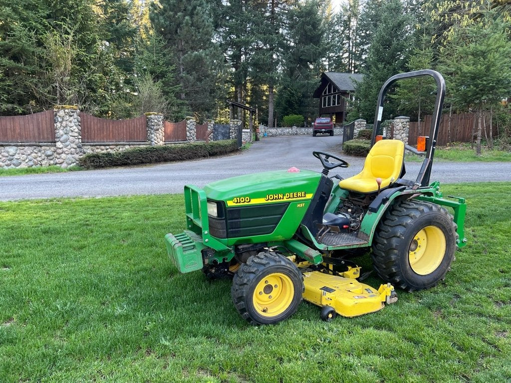 Rear view of the John Deere 4100 highlighting the turf tire tread and tractor hitch