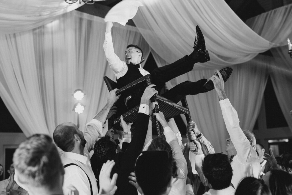 Energetic Jewish wedding reception dance, filled with joy and tradition.