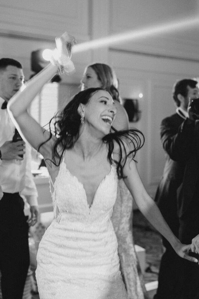 Bride dancing and having fun at her wedding reception.