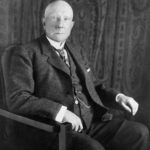 John D. Rockefeller Net Worth Today: Portrait of John D. Rockefeller in 1909, highlighting his status as one of history's wealthiest entrepreneurs.