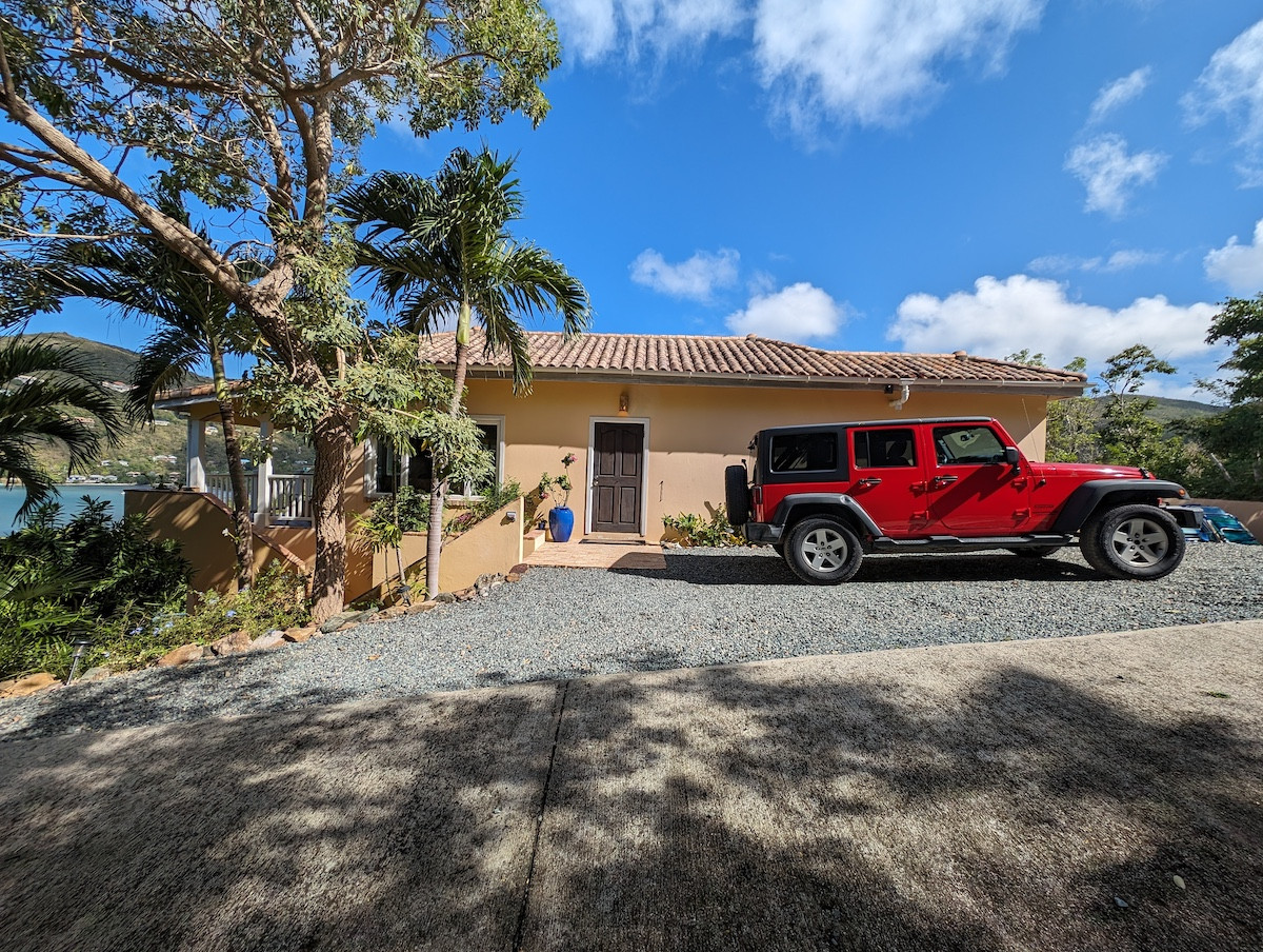 Charming Fish Bay villa with a red Jeep, ideal for exploring St. John