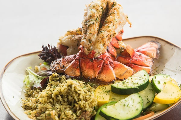 Lobster Tail dusted with Old Bay and garlic butter at St Johns River Steak &amp; Seafood Sanford FL