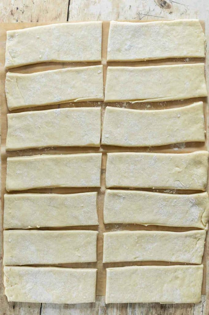 Long John Donuts dough rolled out and cut into rectangular pieces.