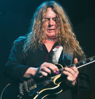 John Sykes performing live with a band