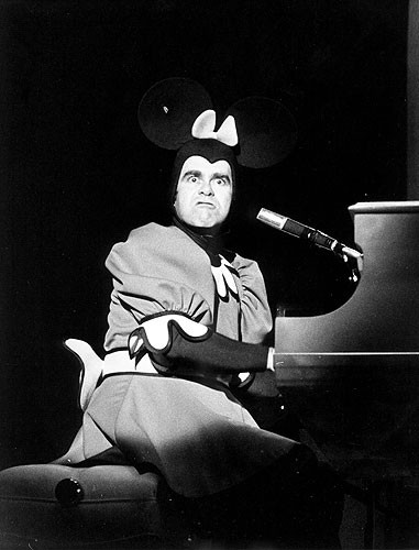 Elton John performing at the Forum in Los Angeles in 1974 wearing a detailed outfit