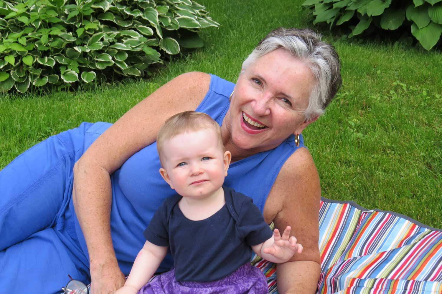 Nana and Emma sharing a picnic blanket