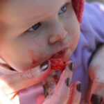 Emma enjoying strawberries, symbolizing savoring life's pleasures
