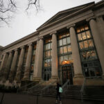 The Harvard Law School library is located behind the Science Center Plaza. John Manning became HLS dean in 2017.