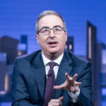 John Oliver, Last Week Tonight host, delivering a monologue with his characteristic energy and wit.