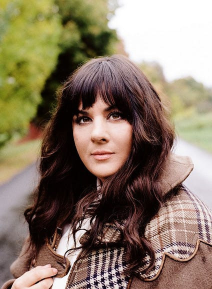 Rumer, a British singer-songwriter, known for her soulful rendition of &quot;Love is the Answer&quot; and praised by musical legends like Elton John.