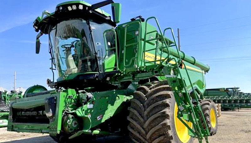 John Deere X9 Combine Cutting Through A Field