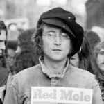 John Lennon attends an unspecified rally in Hyde Park, London, England, 1975.