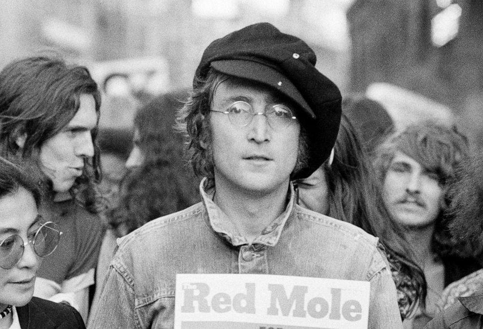 John Lennon attends an unspecified rally in Hyde Park, London, England, 1975.