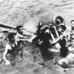 Senator John McCain is pulled out of a Hanoi lake by North Vietnamese army soldiers and civilians on Oct. 26, 1967