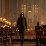 Keanu Reeves in John Wick: Chapter 4, focused on his determined expression and the intense atmosphere of the film