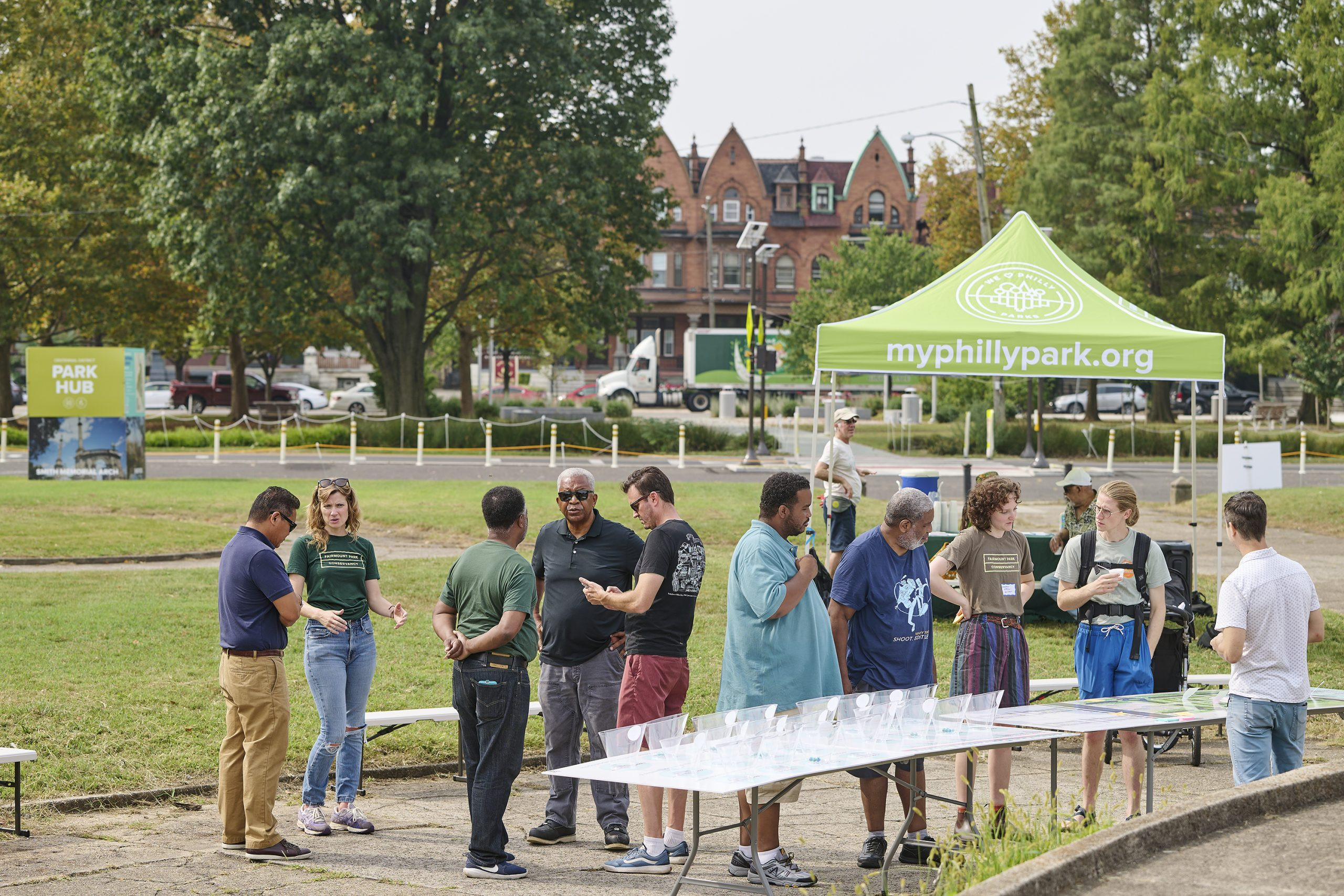 Participants sharing feedback and enjoying water ice at the Welsh Fountain site, contributing to the design process